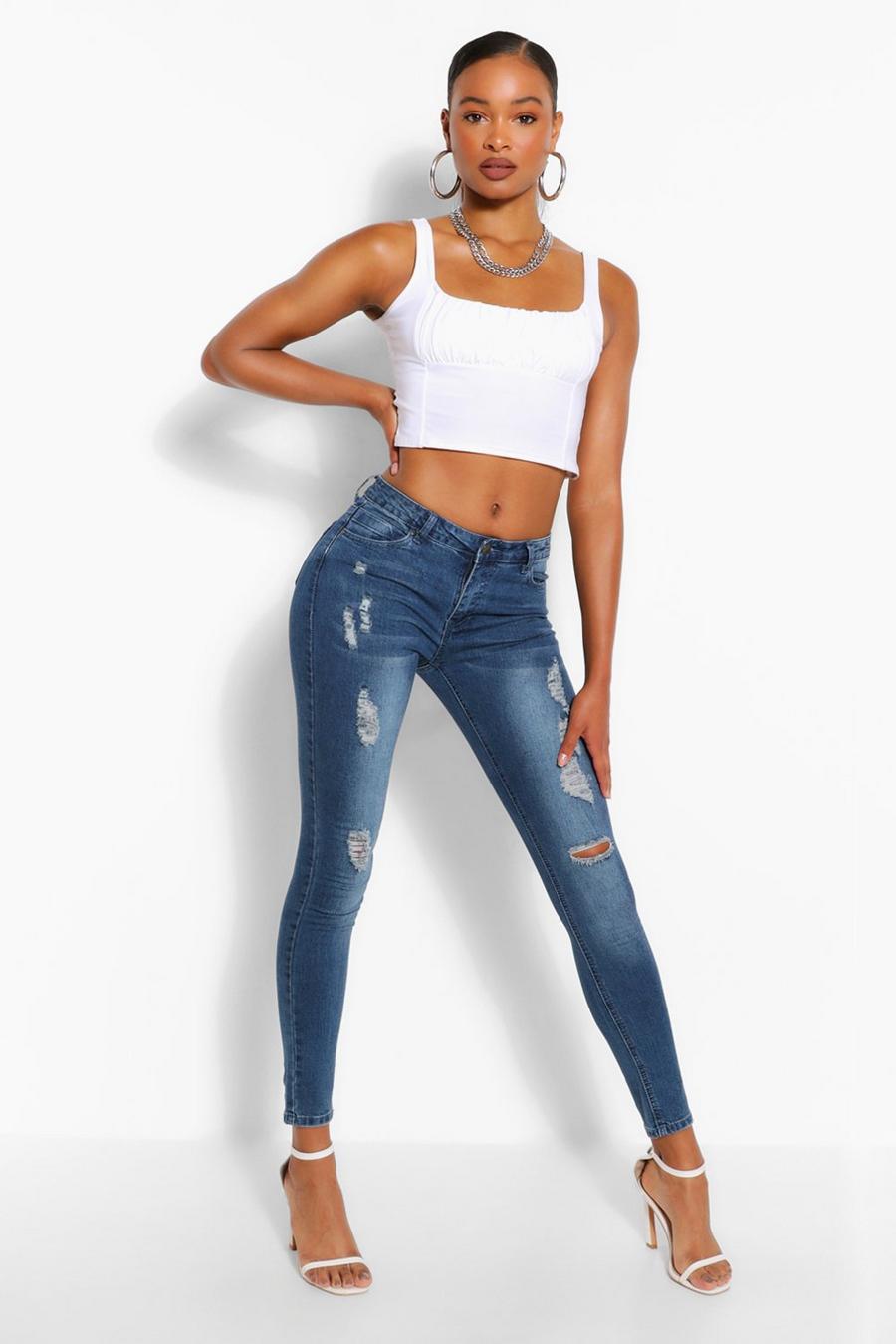 Mid blue Mid Rise Distressed Stretch Skinny Jean image number 1