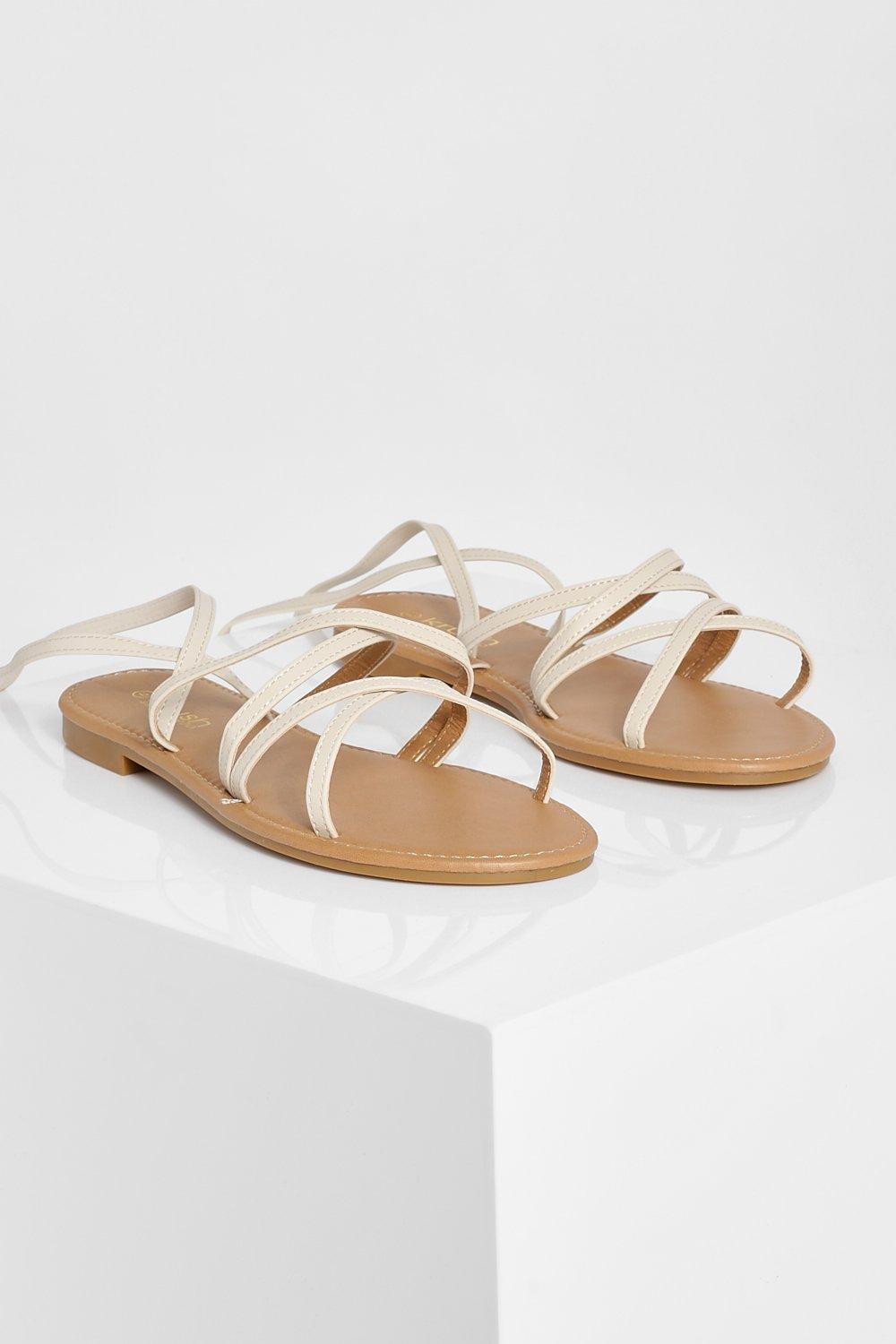 Flat sandals that on sale tie around the ankle