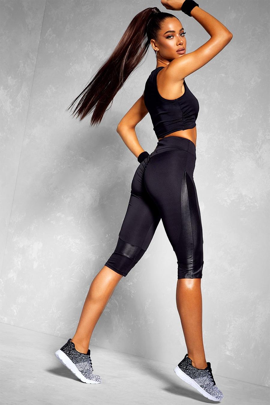 https://media.boohoo.com/i/boohoo/fzz74691_black_xl/female-black-fit-booty-boost-wet-look-panel-gym-capri-leggings/?w=900&qlt=default&fmt.jp2.qlt=70&fmt=auto&sm=fit