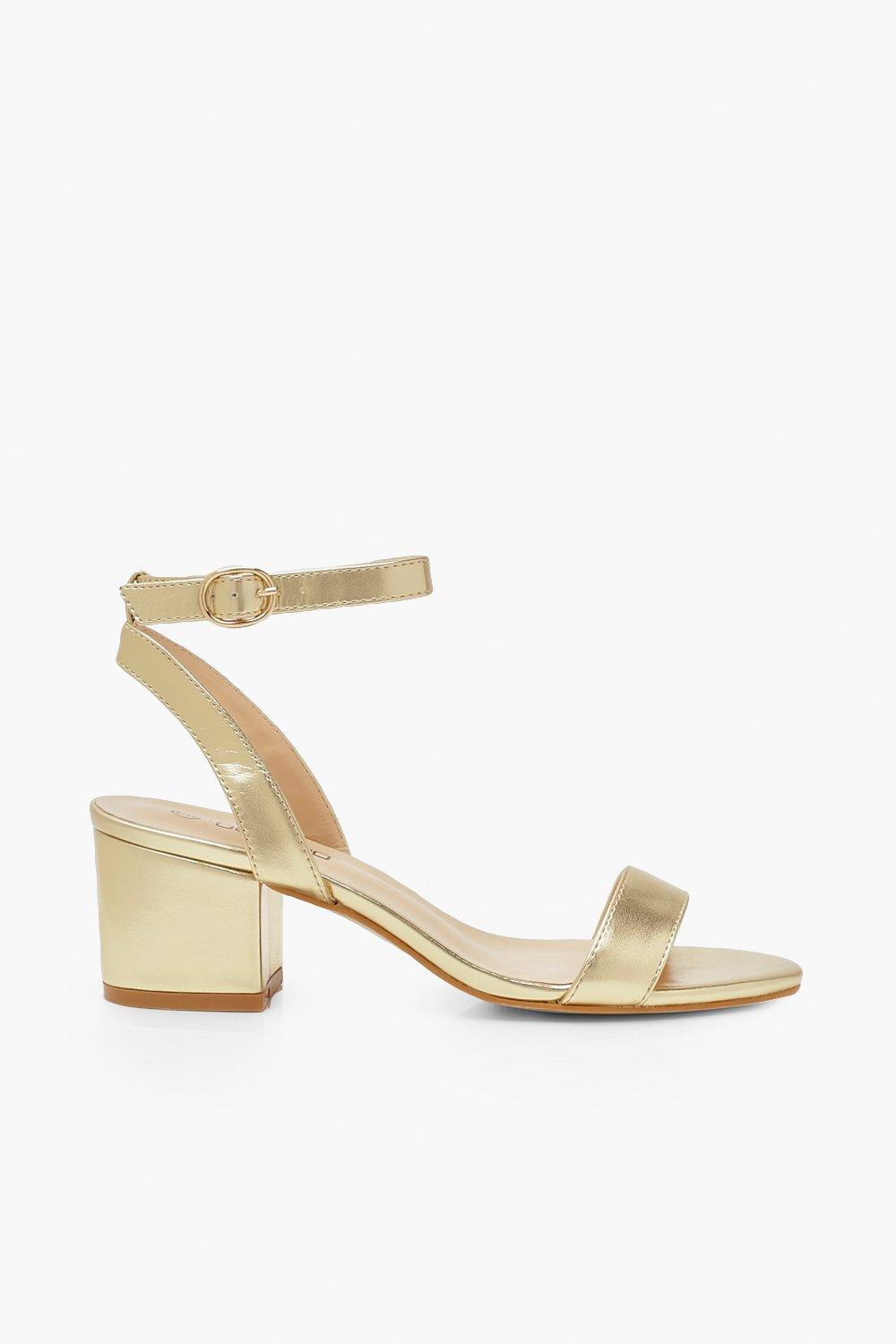 Gold low block store heels