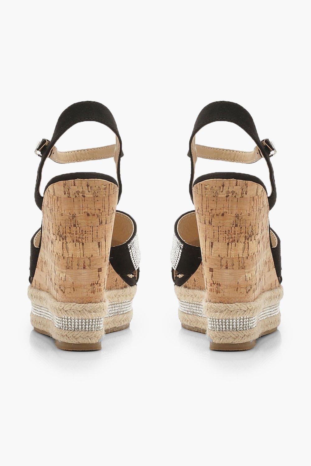 Glitzernde Schuhe mit Keilabsatz aus Kork mit überkreuzten Riemen