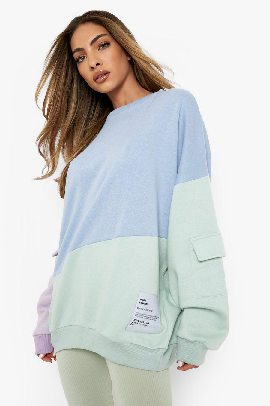 Pastel blue Oversize sweatshirt med cargofickor och blockfärger image number 1