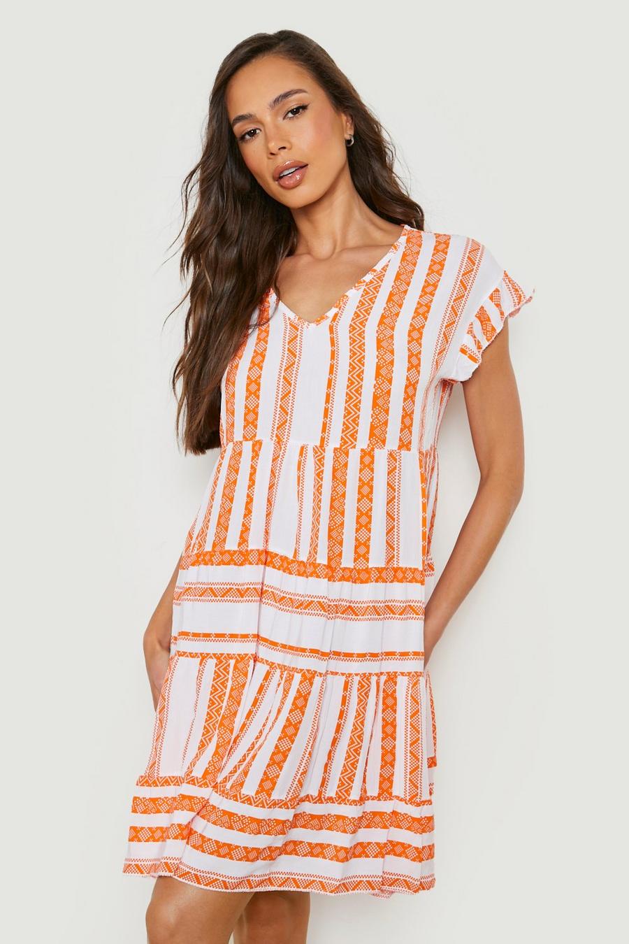 Orange Mönstrad klänning med volanger