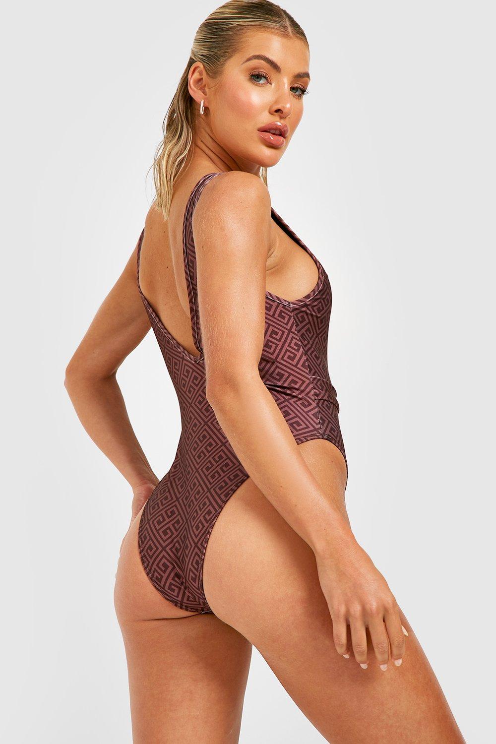 https://media.boohoo.com/i/boohoo/gzz30373_brown_xl_1/female-brown-contrast-geo-plunge-belted-swimsuit