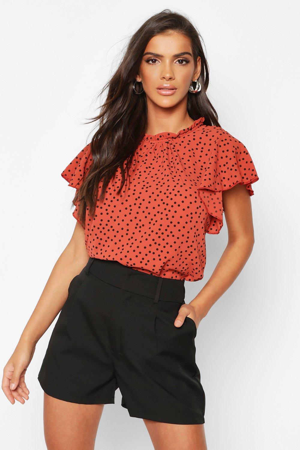 rust polka dot blouse