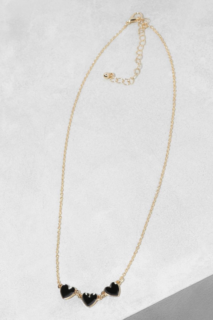 Goldene Halskette mit drei schwarzen Enamel-Herzen, Gold métallique