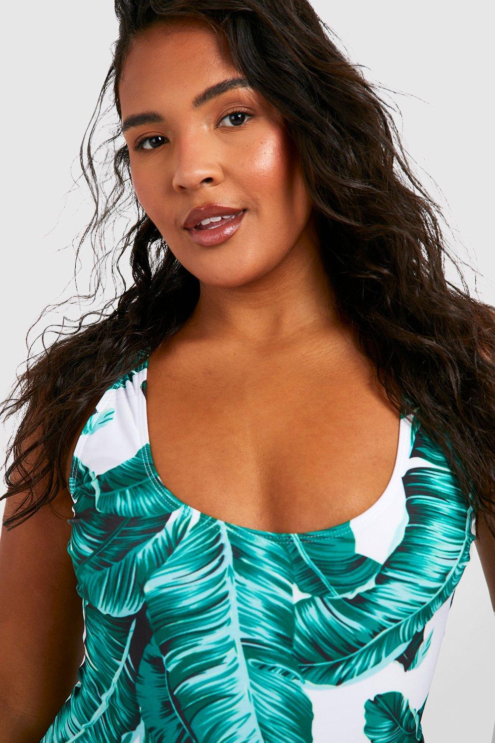 White swimsuit with green on sale leaves