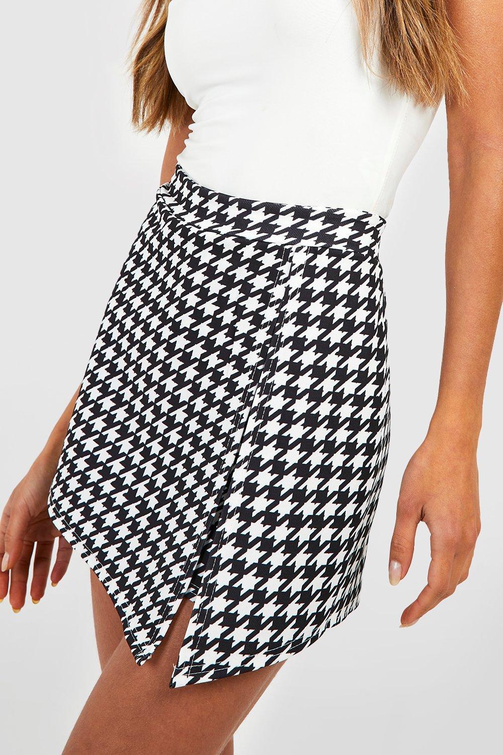 Tennis skirt, houndstooth tights and button up shirt with a black