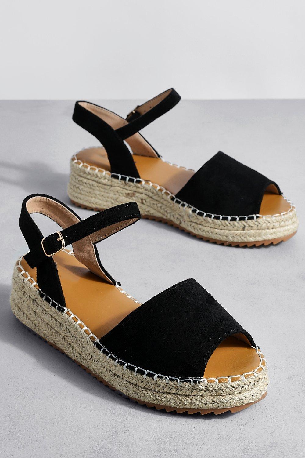 Black and 2025 gold flatforms