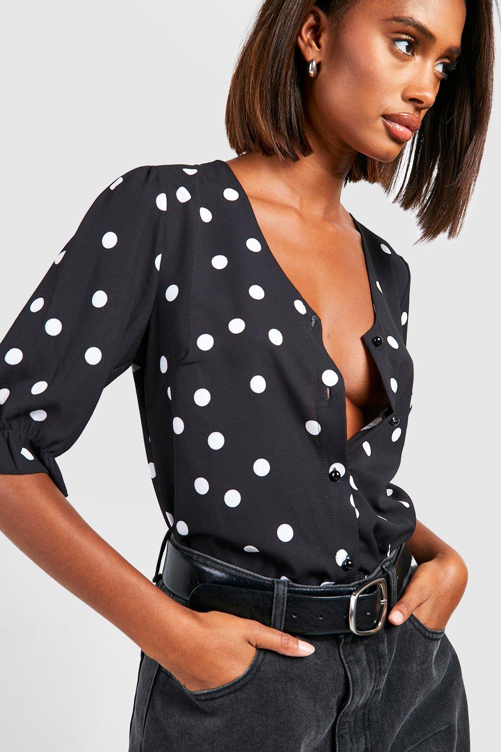 Women's white blouse with black store polka dots