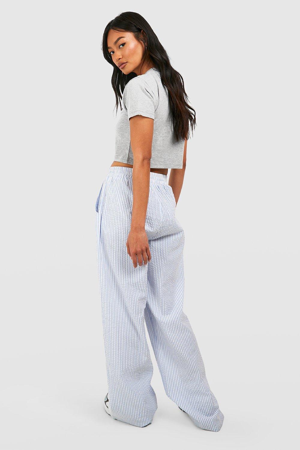 blue wrap around crop top, striped palazzo pants, wide leg pants