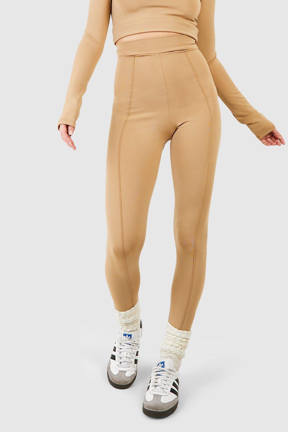 https://media.boohoo.com/i/boohoo/gzz66489_taupe_xl_3/female-taupe-woven-tab-detail-deep-waist-pintuck-workout-leggings