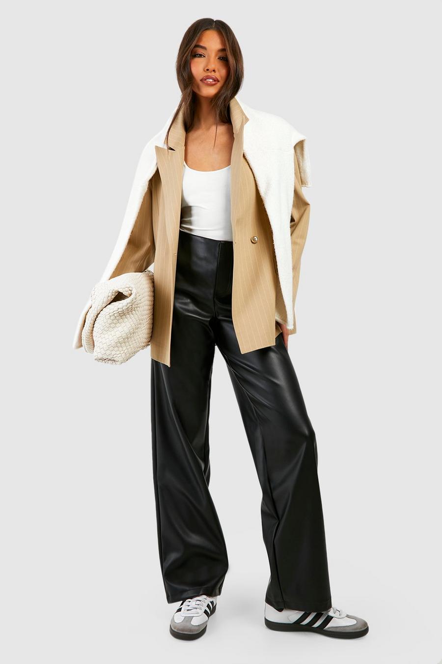 Low-rise flared faux leather pants in brown - Rotate
