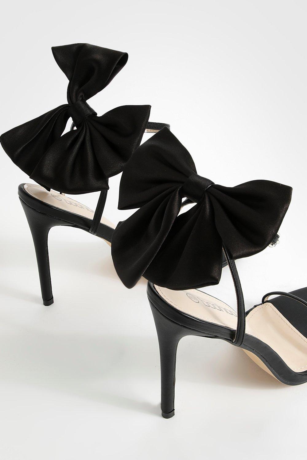 Black high clearance heels with bow