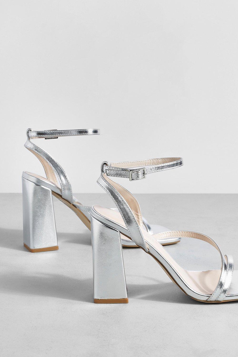 https://media.boohoo.com/i/boohoo/gzz67214_silver_xl_2/female-silver-asymmetric-stap-block-heels