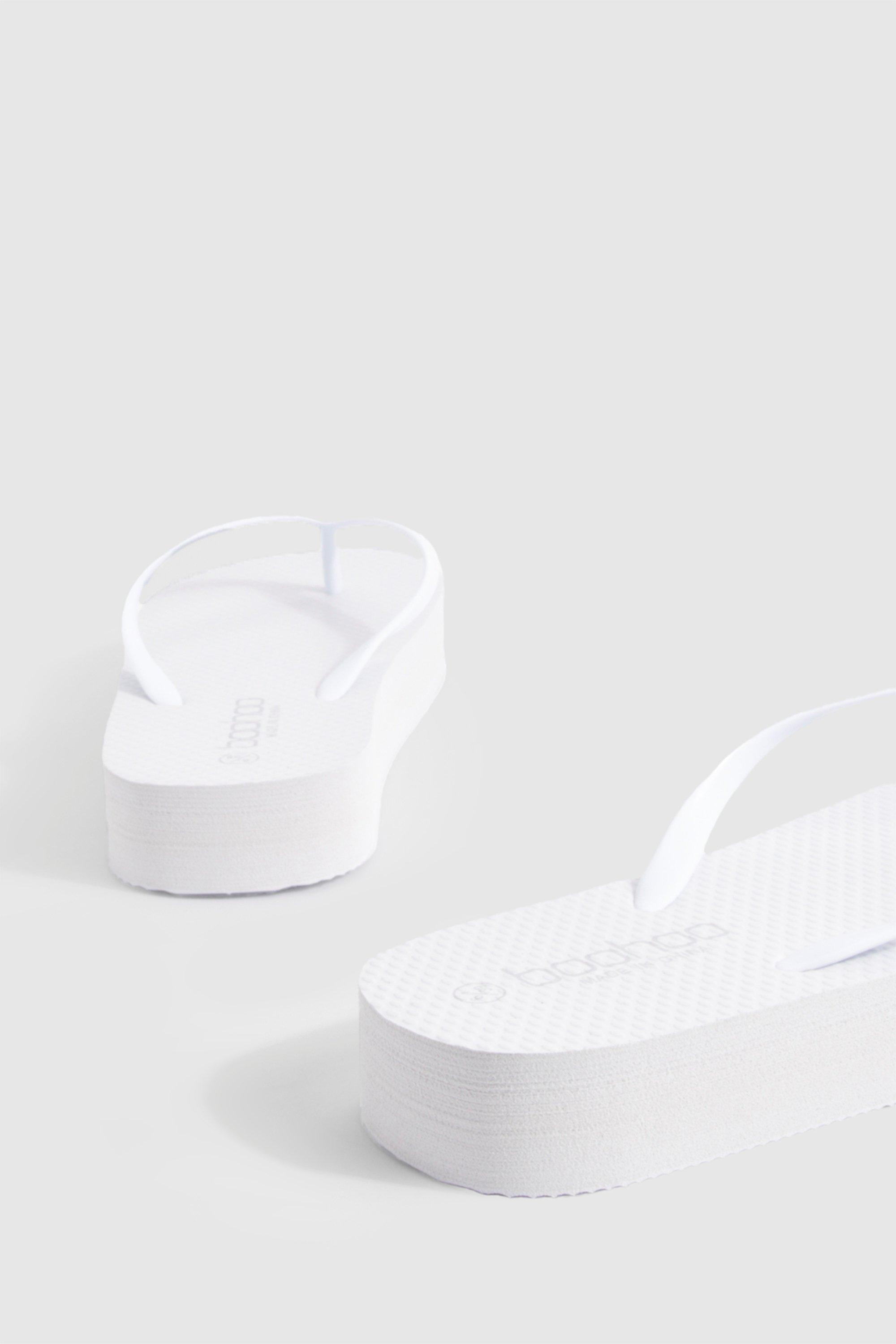 White wedge flip flops hotsell