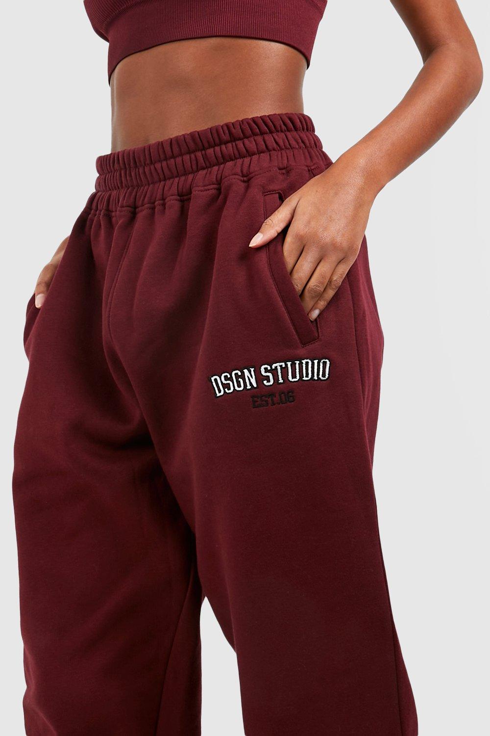 https://media.boohoo.com/i/boohoo/gzz78785_burgundy_xl_3/female-burgundy-dsgn-studio-applique-oversized-cuffed-jogger