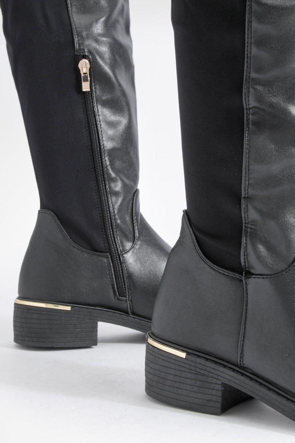 Black knee high hotsell boots with gold trim