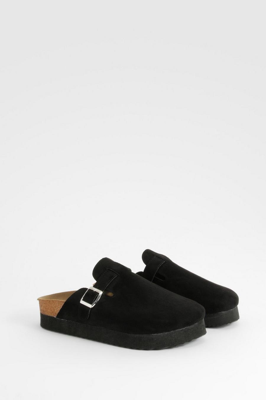 Black Flat sandals featuring leather upper with metallic hardware detailing 