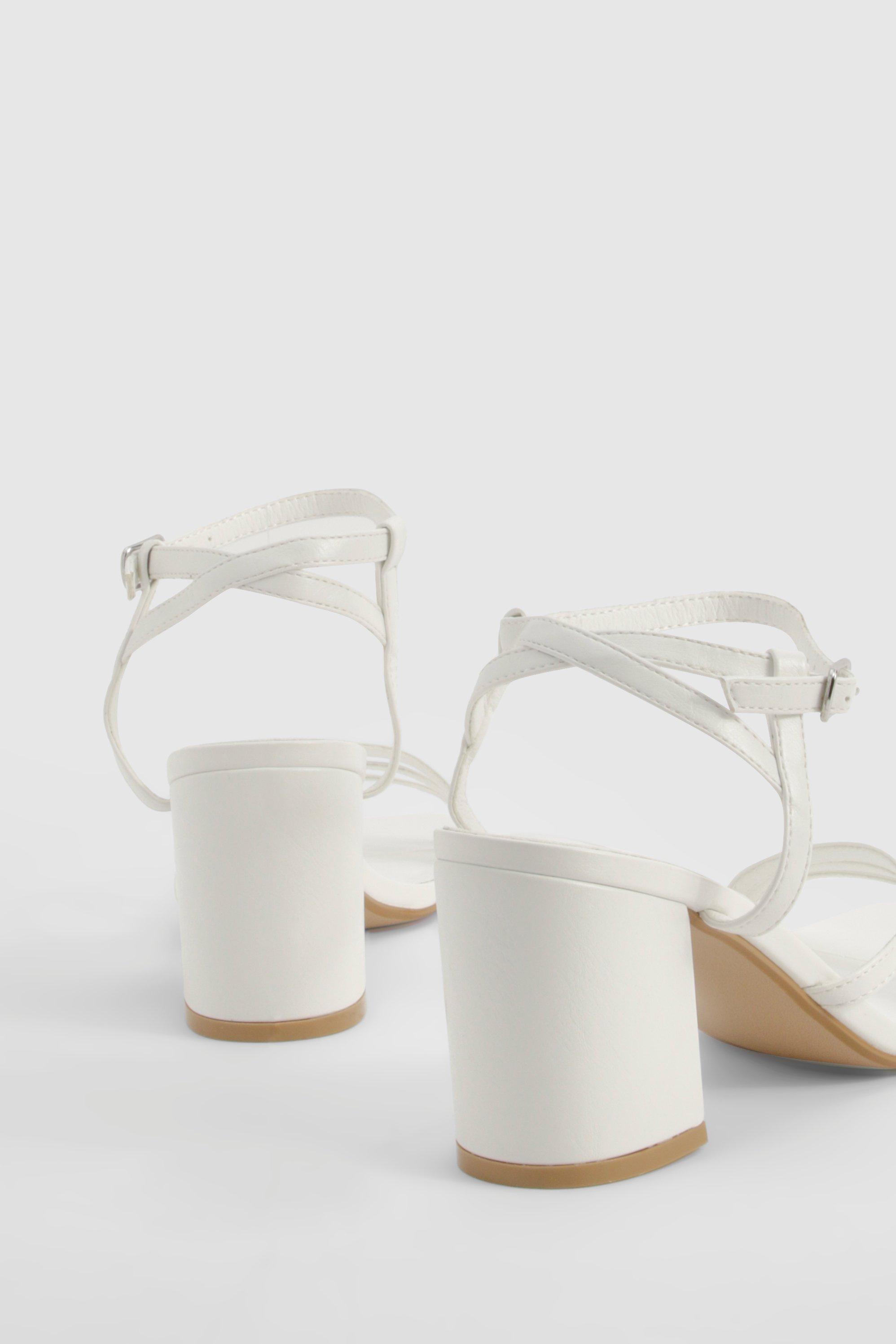 Asymmetrical strappy block heels store