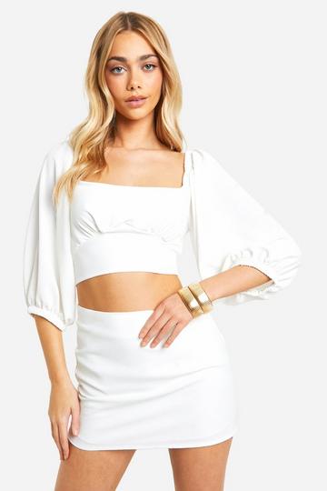 Platgeslagen Crop Top Met Rug Strik En Mini Rokje ivory