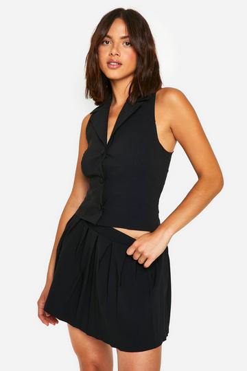 Black Plunge Front Vest & Pleated Mini Skirt