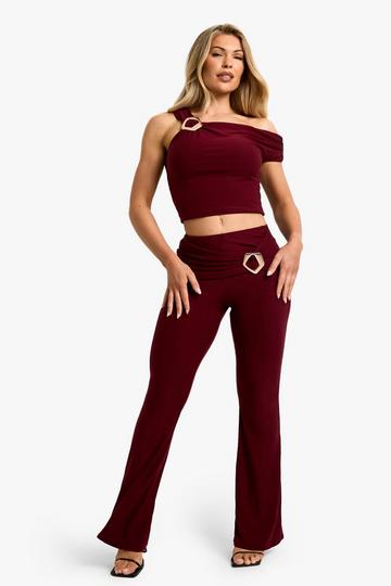 Burgundy Red Slinky Fold Over Metal Trim Skinny Flare Pants