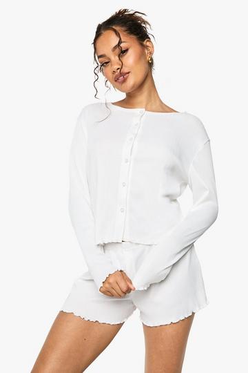 Pointellestickad pyjamas med knappar och rullfåll white