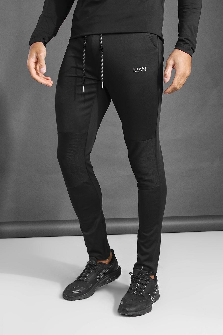שחור מכנסי ריצה ספורטיביים סופר סקיני עם פאנל ריב MAN image number 1