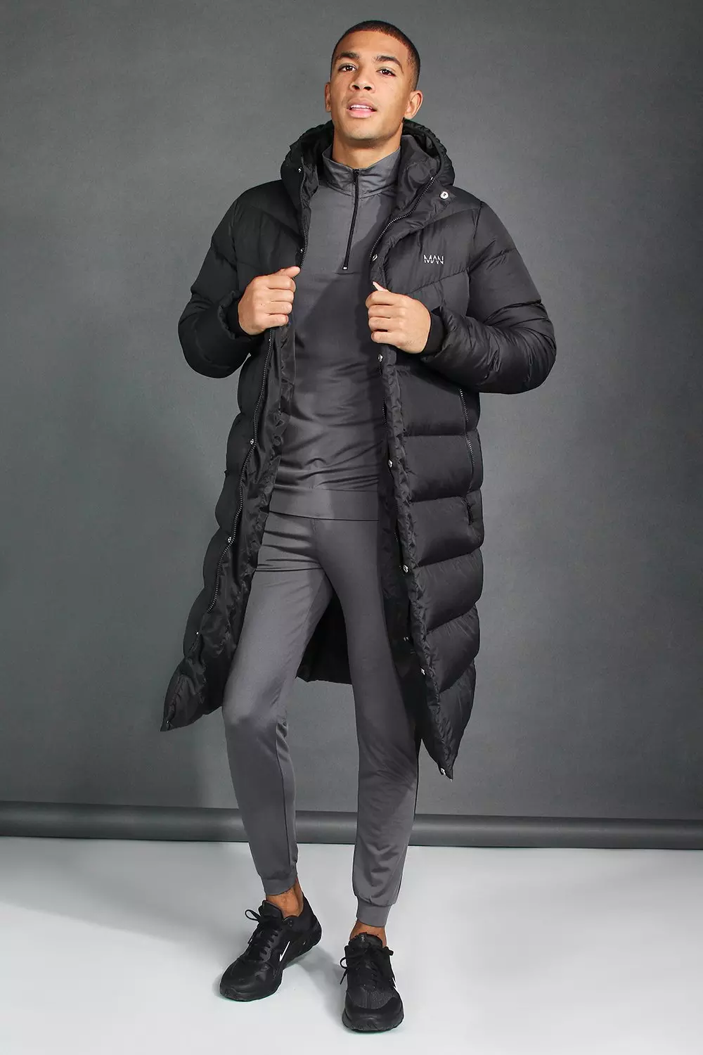 Nike black small logo longline hot sale padded jacket