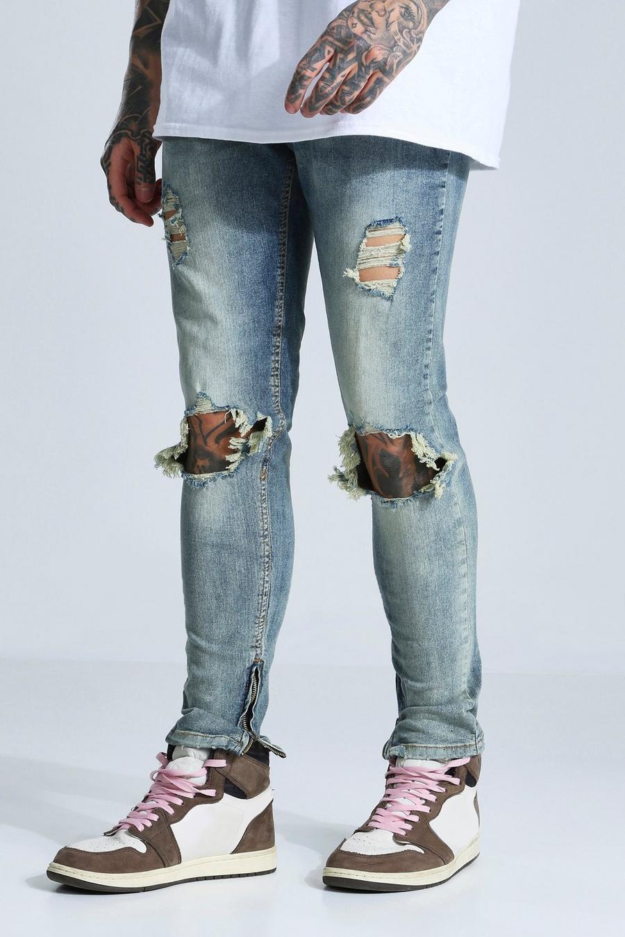כחול עתיק סקיני ג'ינס נמתח ripped עם קרעים גדולים בברך image number 1