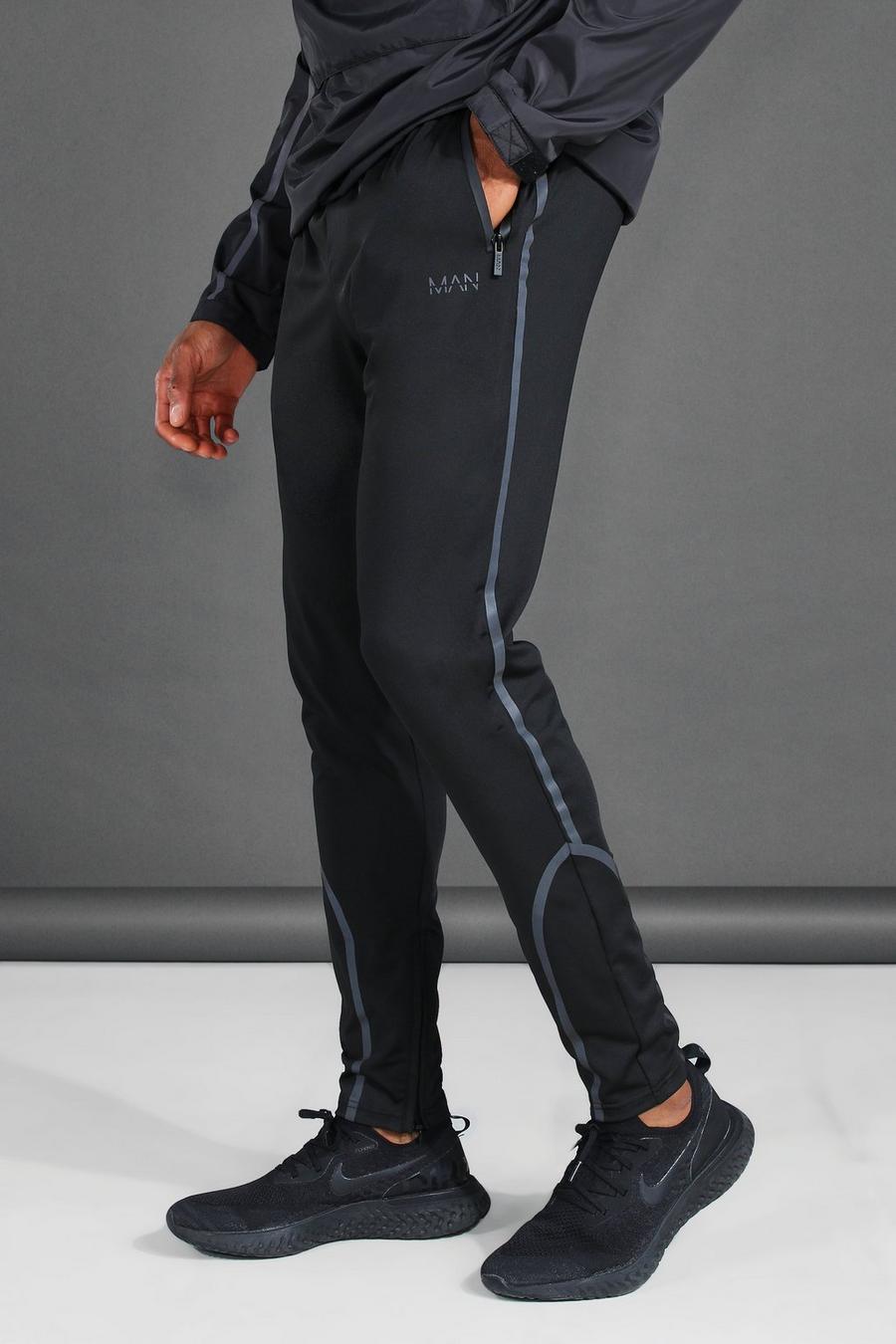 Reflektierende Active Skinny Jogginghosen mit MAN-Print, Schwarz image number 1