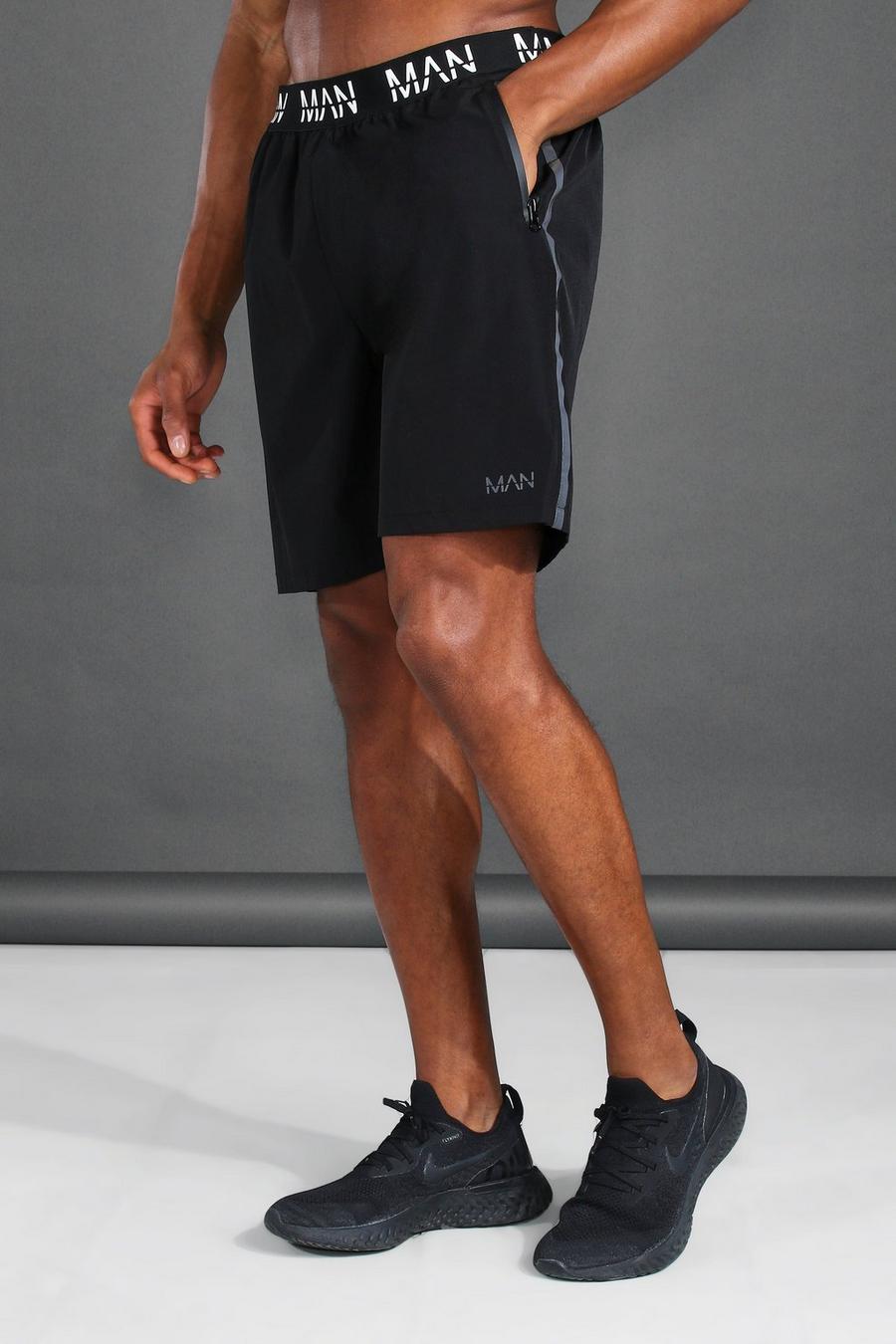 Reflektierende Active Shorts mit „MAN“-Print, Schwarz image number 1