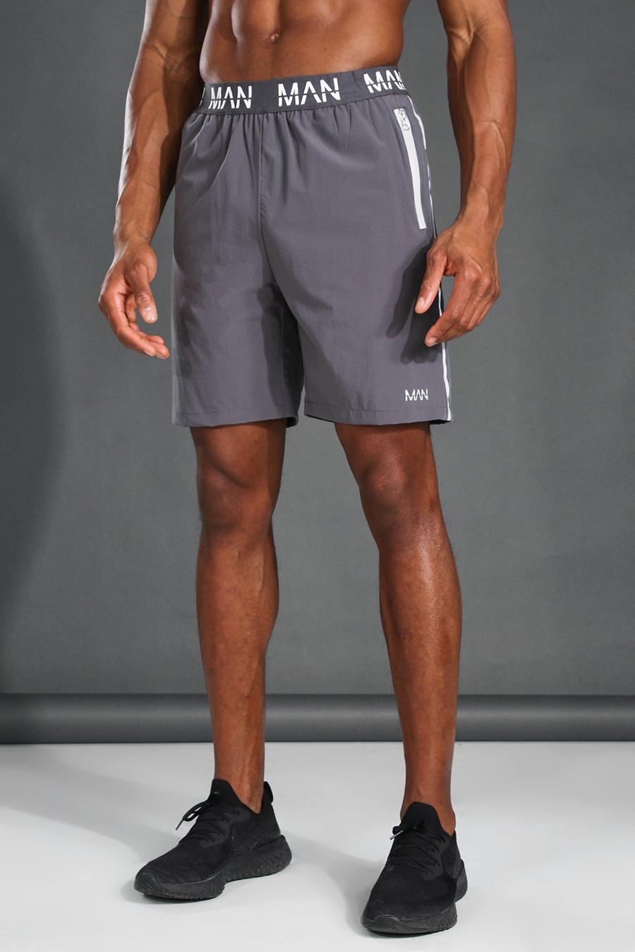 Reflektierende Active Shorts mit „MAN“-Print, Grau image number 1