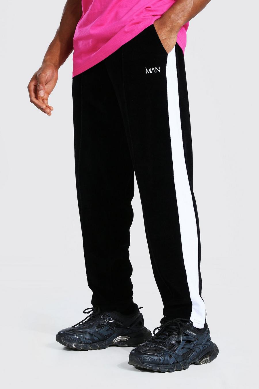 שחור מכנסי ריצה מבד דמוי קטיפה בגזרה משוחררת עם כיתוב Man Official image number 1