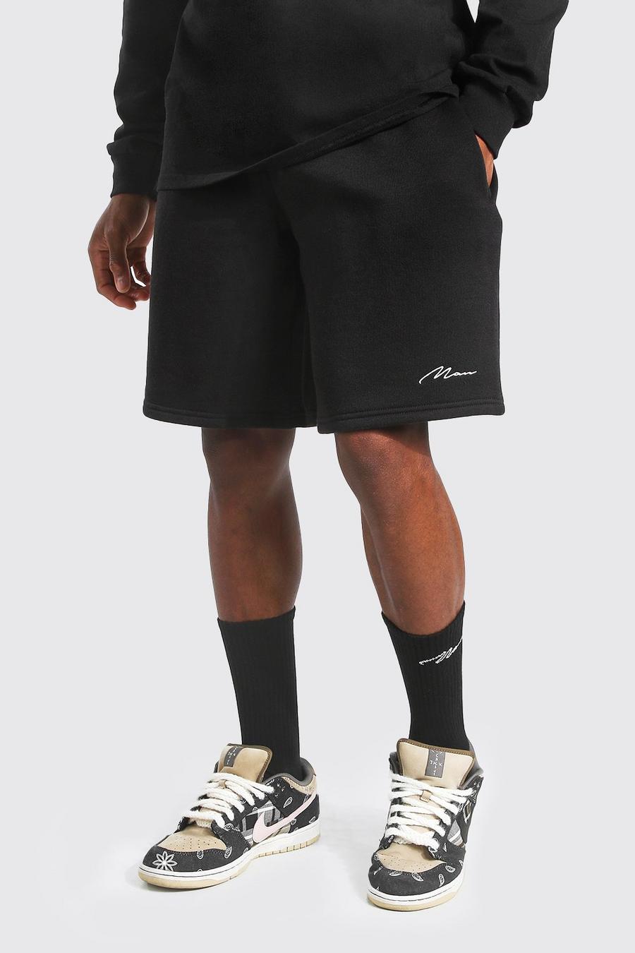 Pantalones cortos de largo medio anchos de punto con firma Man, Negro image number 1