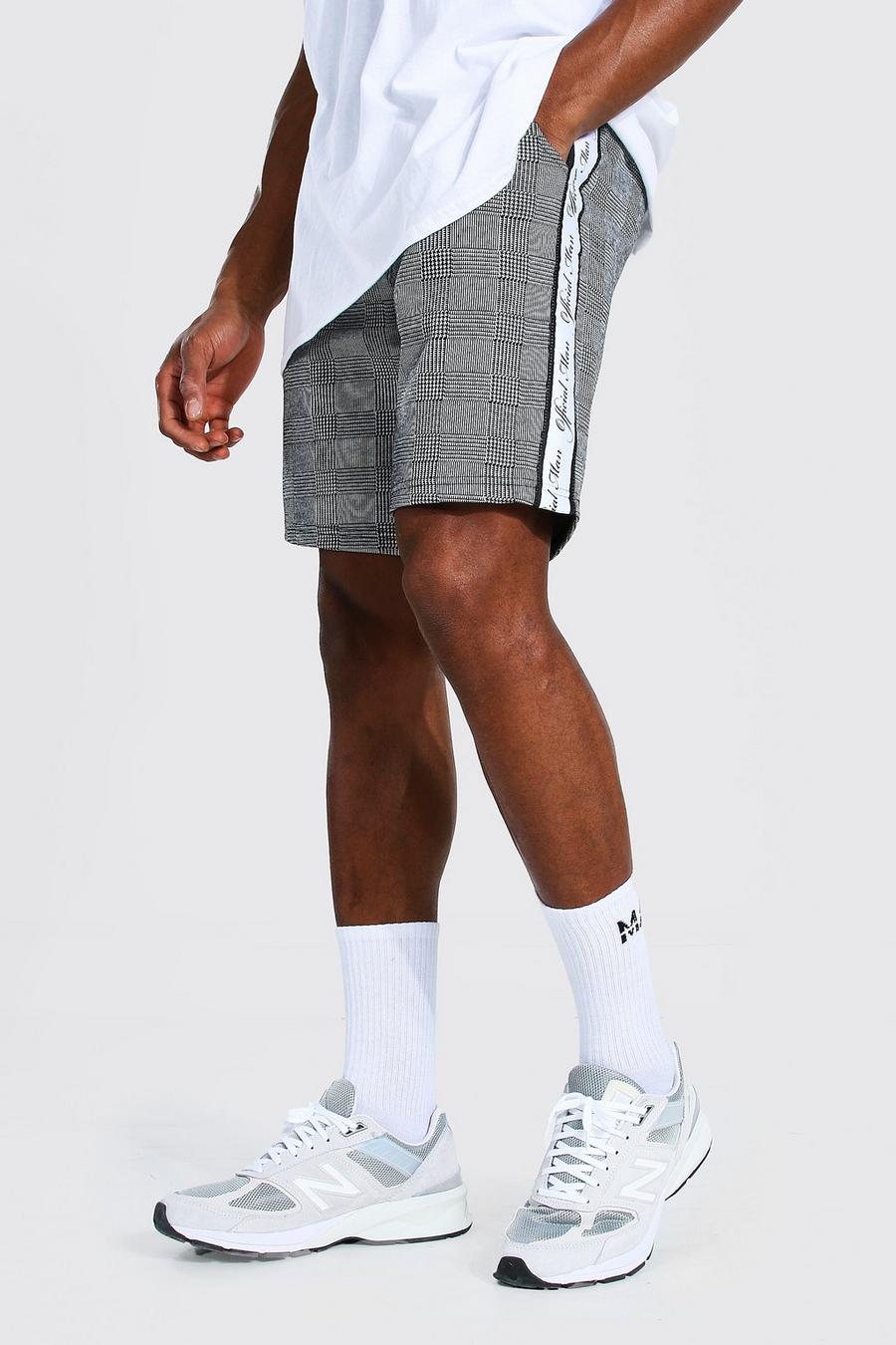 Pantalones cortos de punto medio de jacquard con cinta Official Man, Negro image number 1