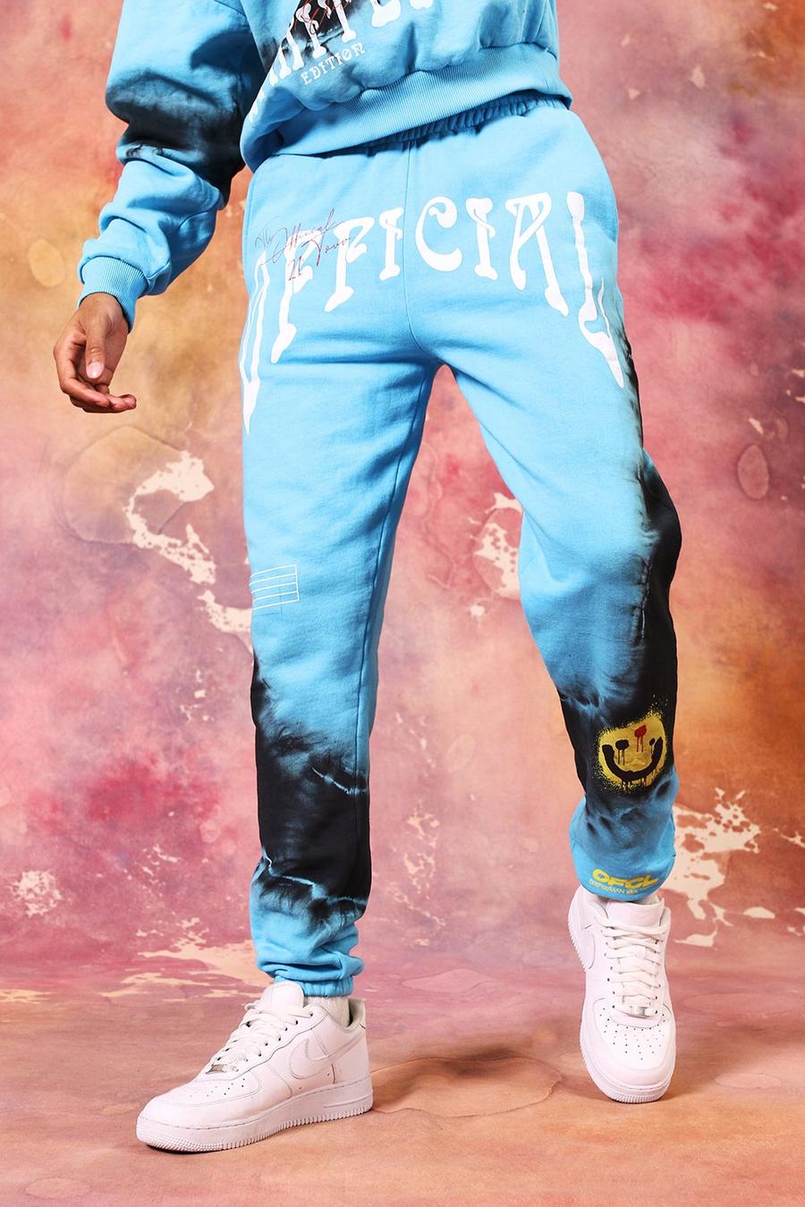 כחול מכנסי ריצה בייסיק טאי-דאי עם הדפס פרצוף נוזל וכיתוב Official image number 1