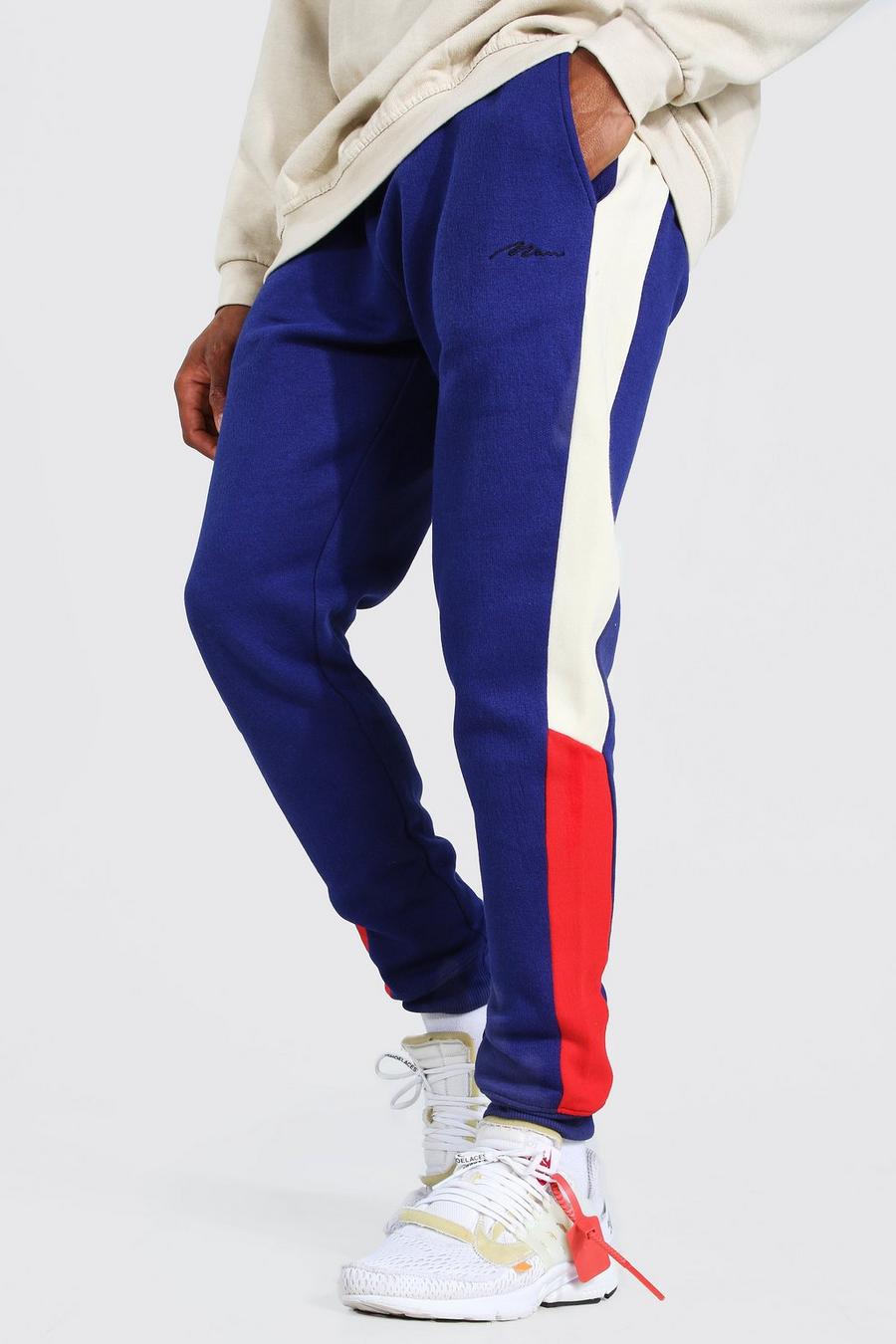Pantalones de deporte con franjas laterales skinny ajustados de la firma MAN, Azul marino image number 1