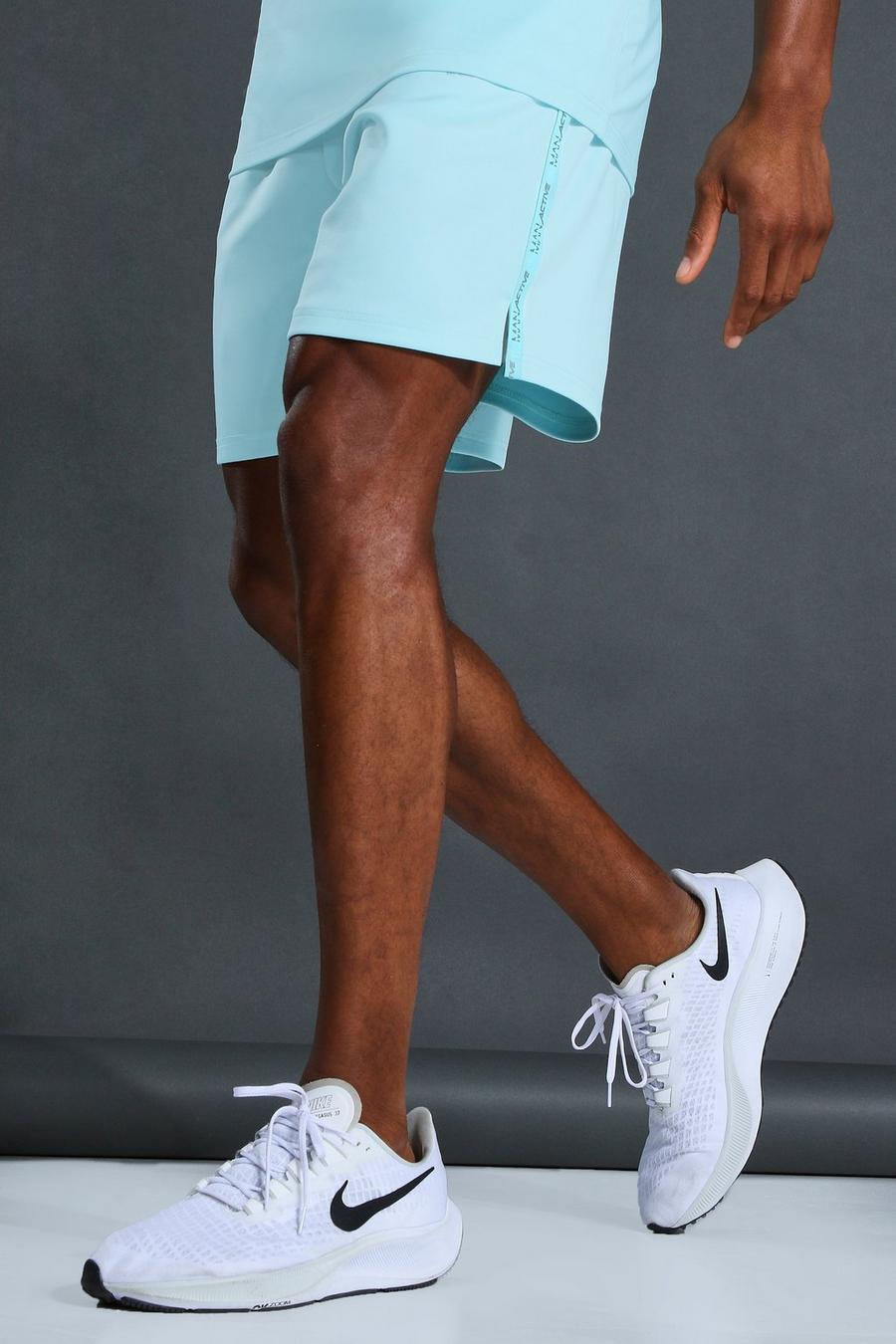 Light blue Man Active Taped Shorts image number 1