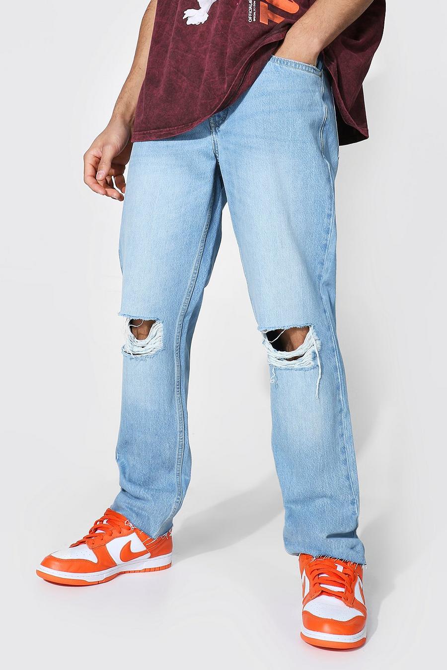 Light blue Raka jeans med slitna knän och fransig kant image number 1