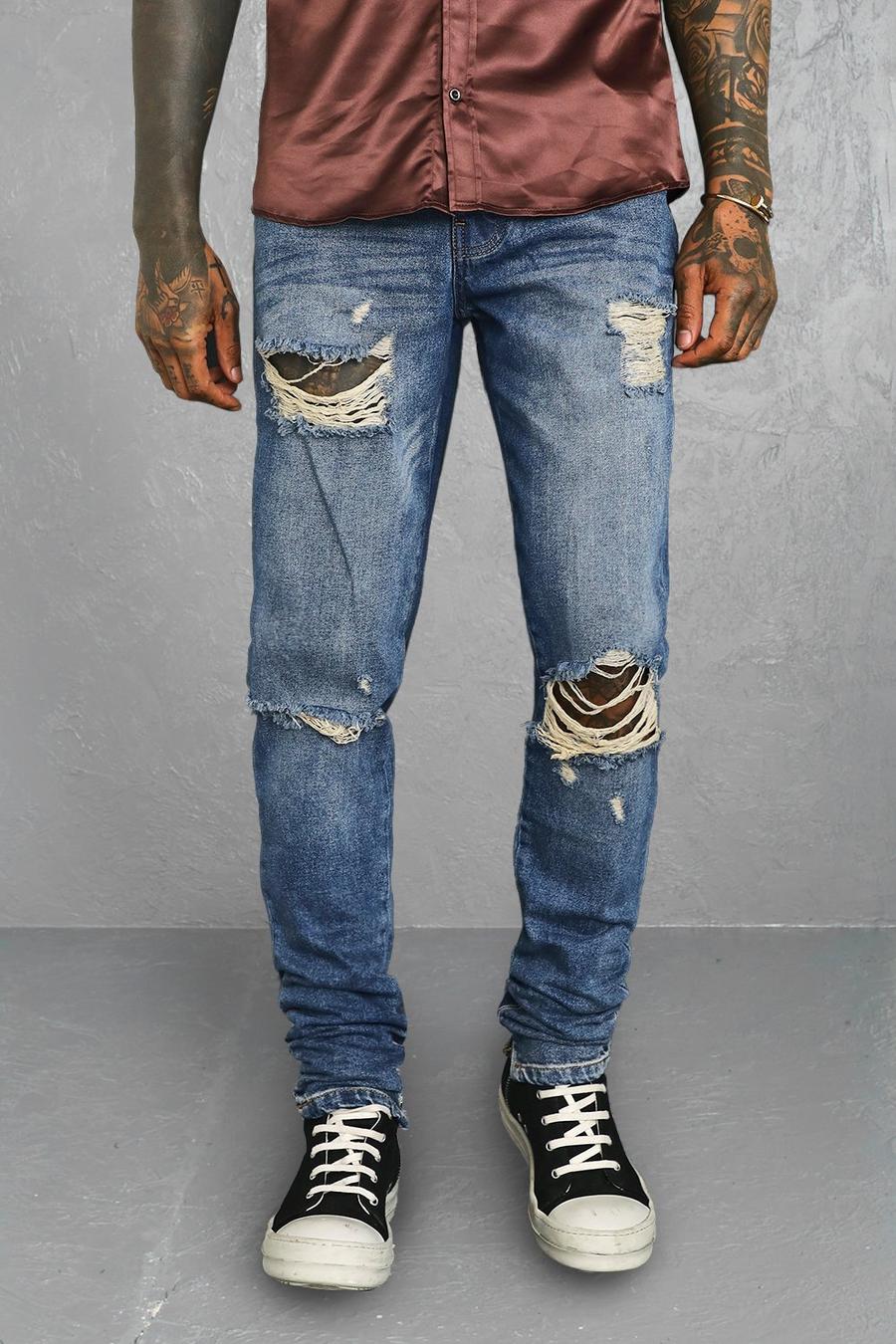 כחול עתיק ג'ינס בגזרת קרסול צרה נערמת עם קרעים גדולים בברכיים image number 1