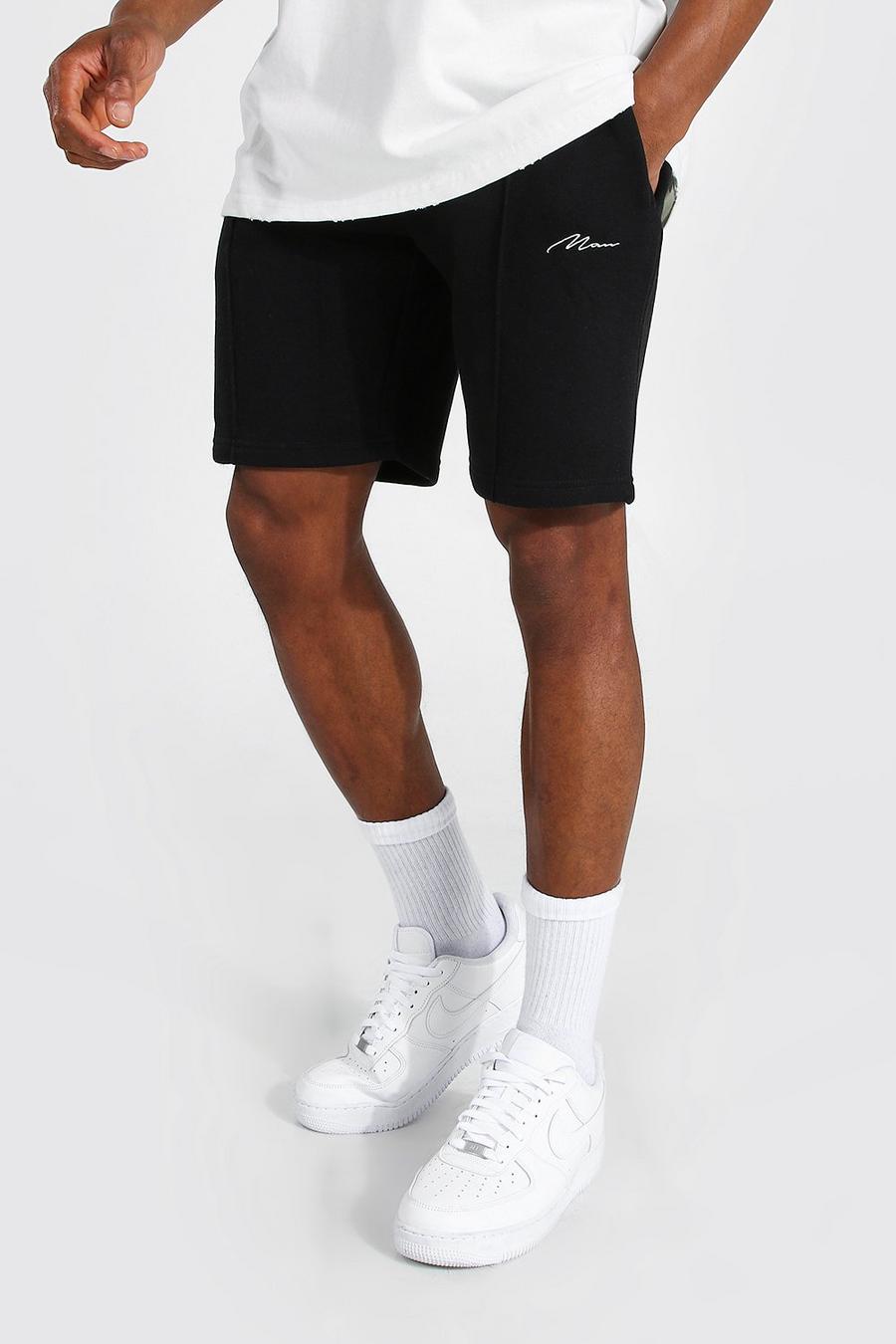 Pantalones cortos con firma MAN Regular de tela jersey con alforza, Negro image number 1