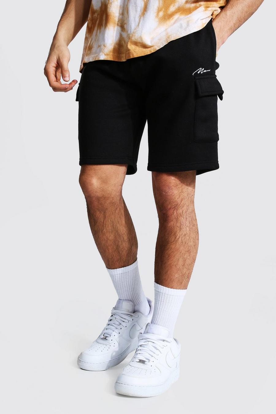 Pantalones cortos MAN Signature cargo de tela jersey con largo medio, Negro image number 1