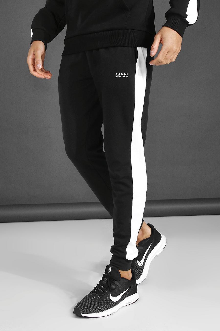 שחור מכנסי ריצה סקיני מבד ג'רסי עם פאנלים בצדדים וכיתוב Man image number 1