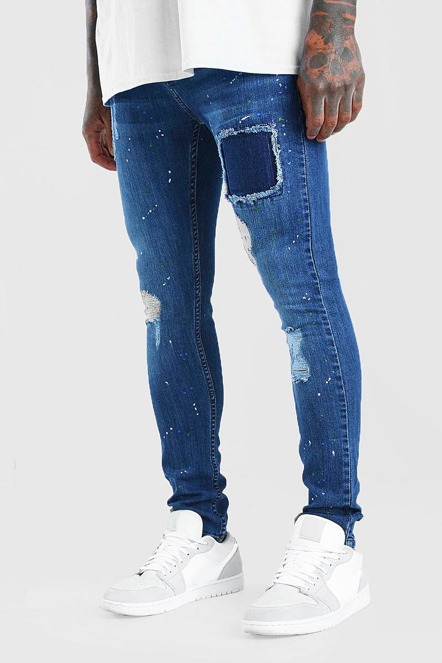Super skinny jeans med slitna detaljer och färgstänk image number 1
