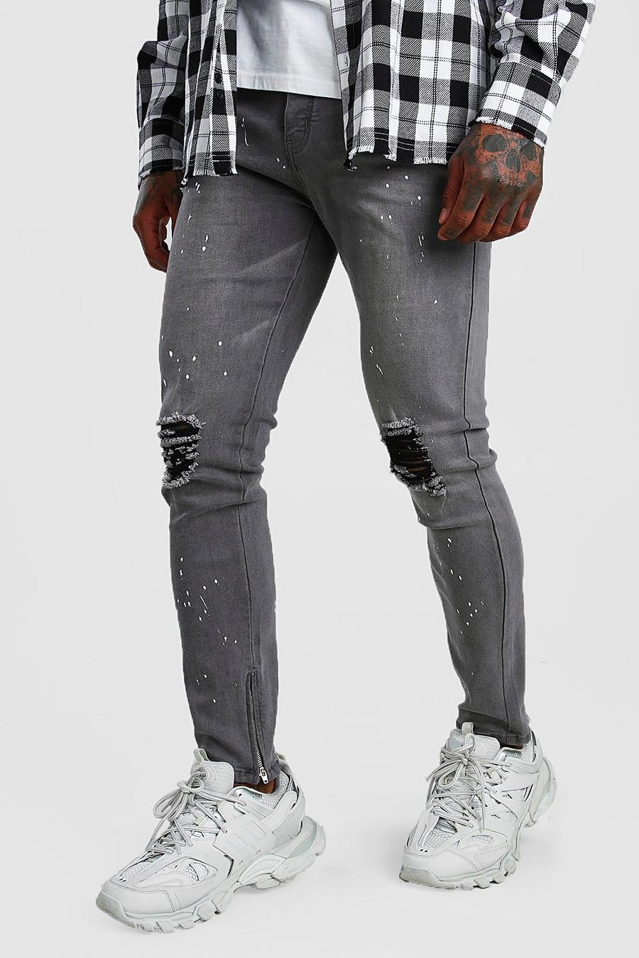 Skinny jeans med färgstänk och dragkedjor i bensluten image number 1