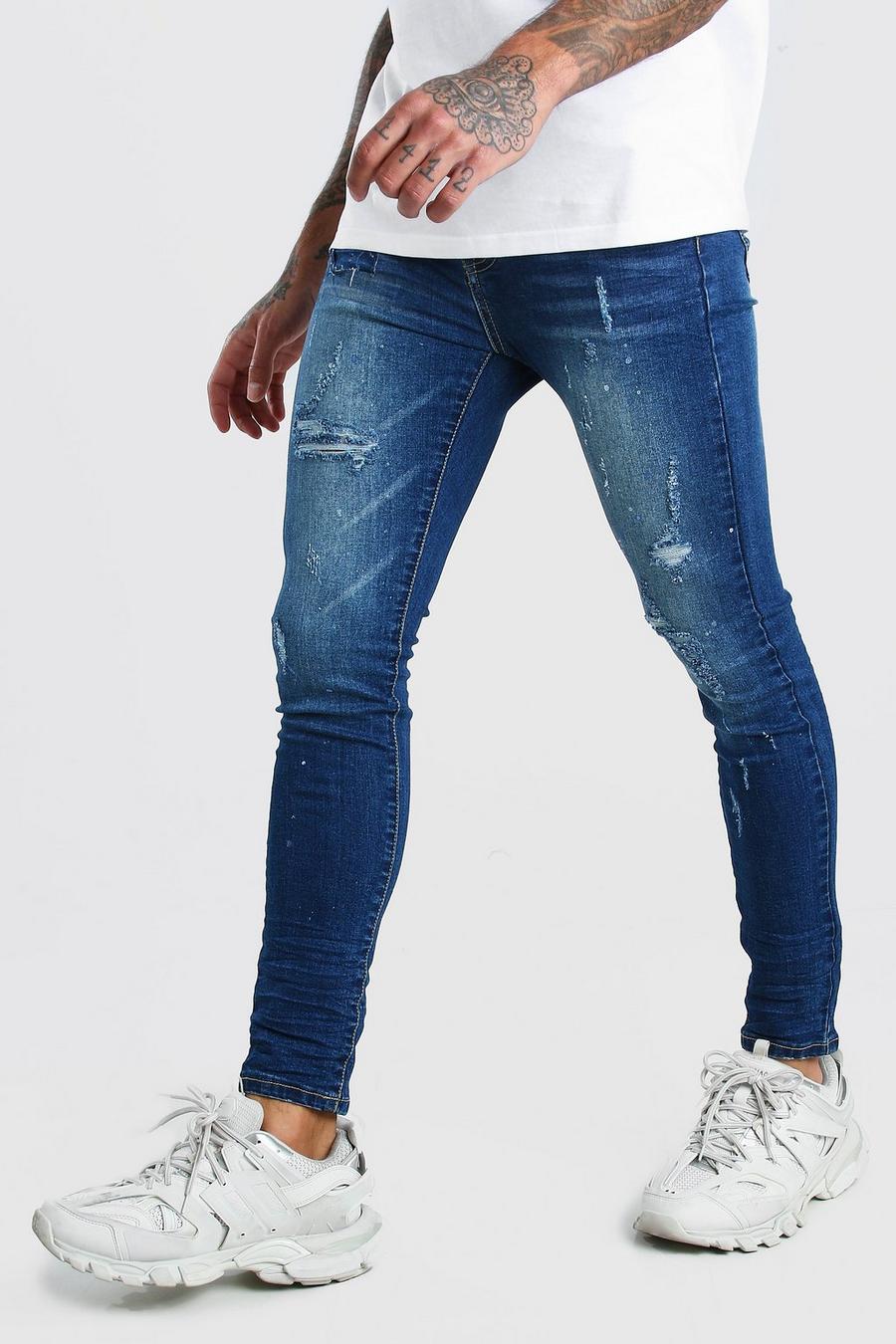 אינדיגו דהוי סופר סקיני ג'ינס עם קרעים וטלאים בדגומת כתמי צבע image number 1