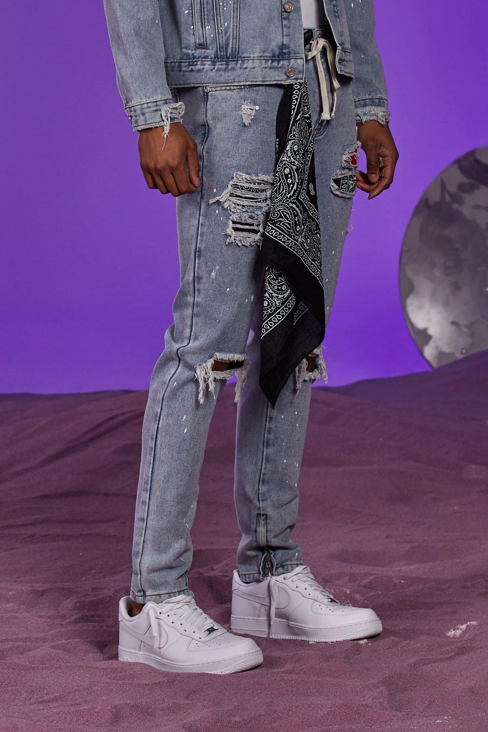 grey jeans with paint splatter