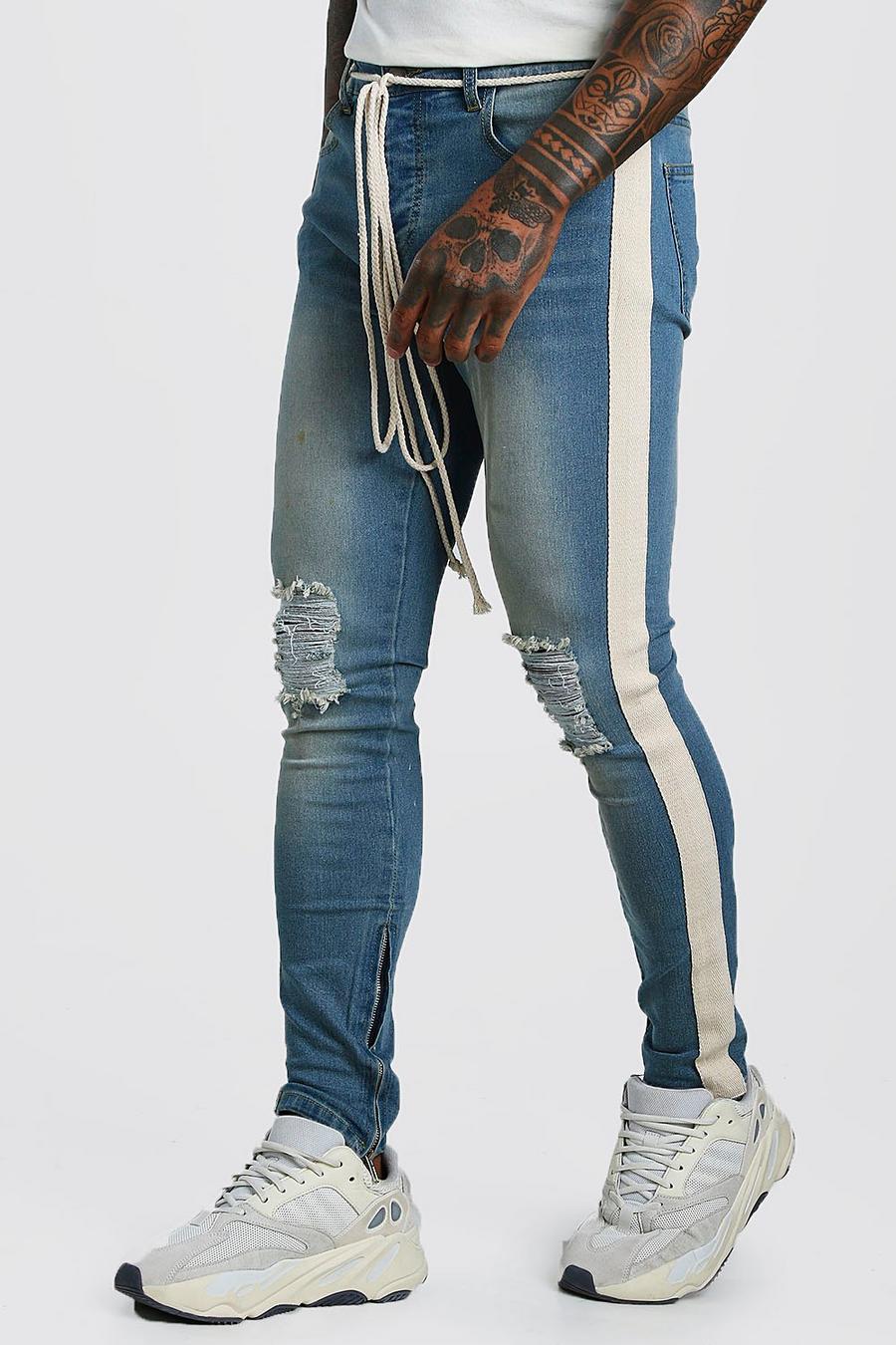 Skinny jeans med slitna knän, kantband och band i midjan image number 1